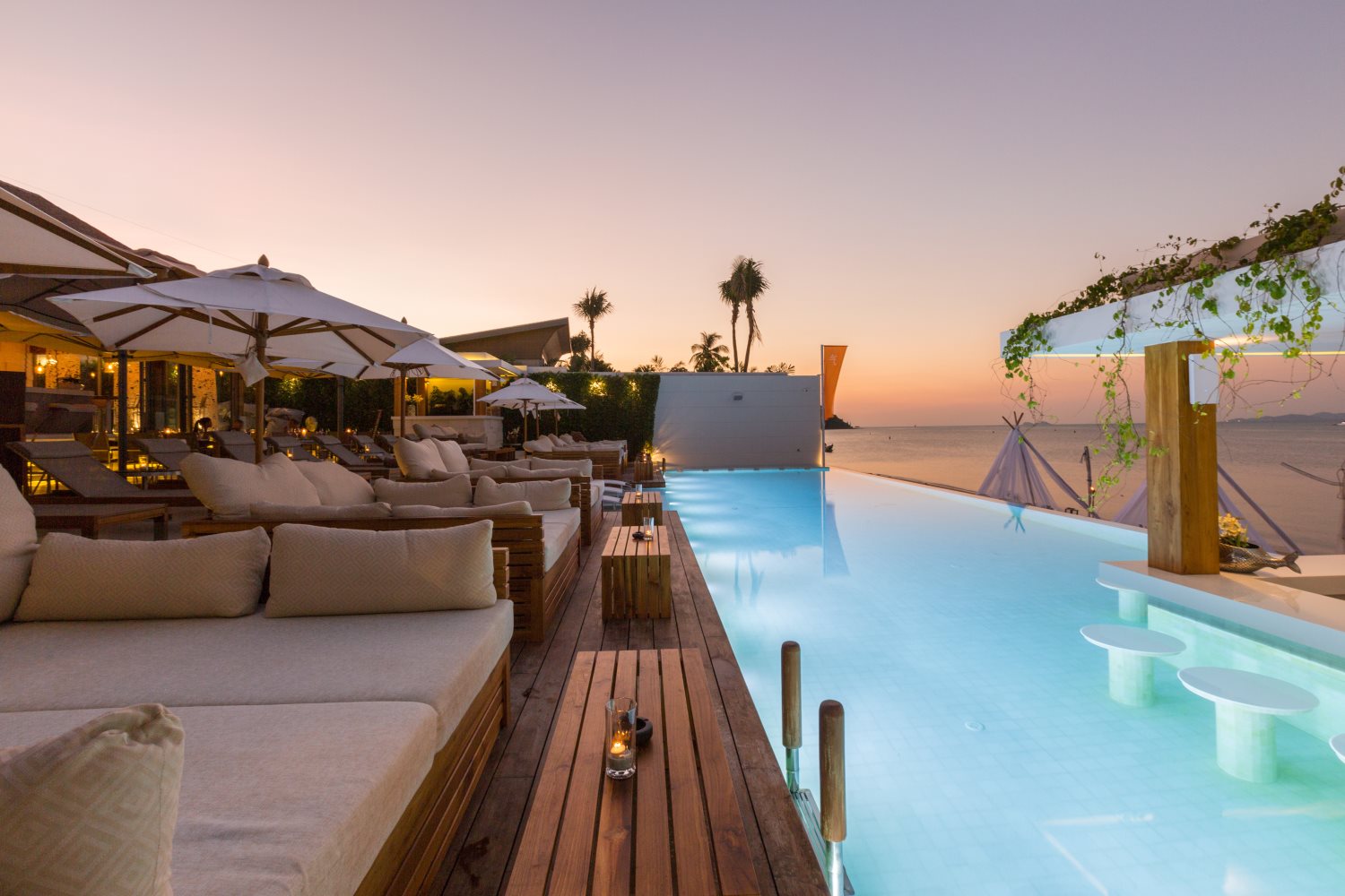 Sunset over the beach club infinity pool
